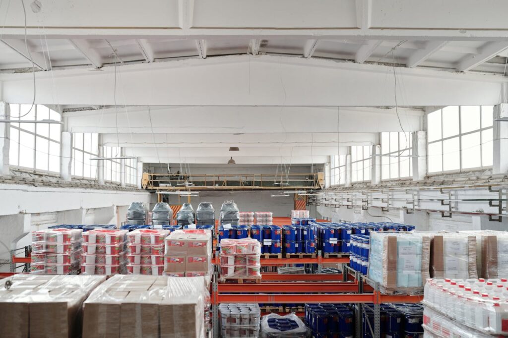 An industrial warehouse stocked with pallets of product.