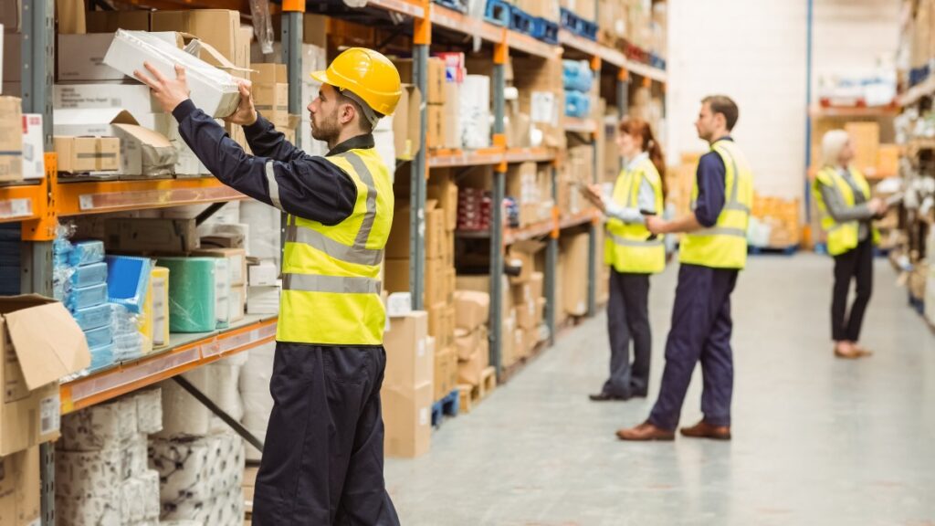 Warehouse workers in safety vests