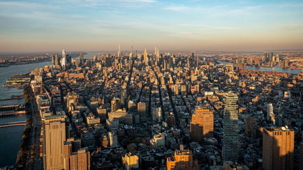 Aerial view of New York City's iconic skyline during sunset highlighting the urban landscape.