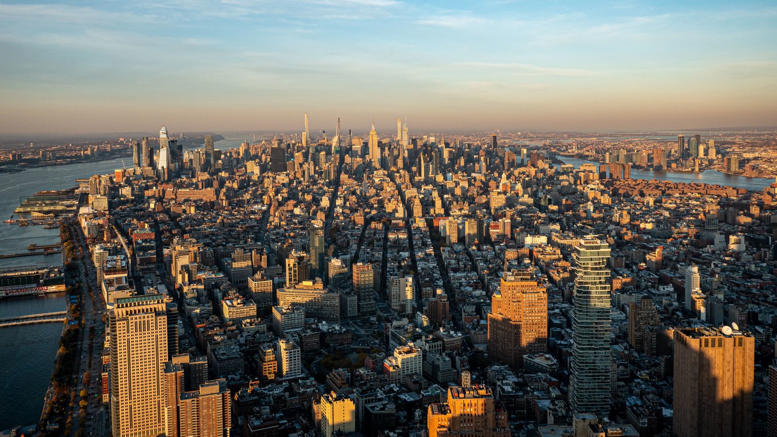 Aerial view of New York City's iconic skyline during sunset highlighting the urban landscape.