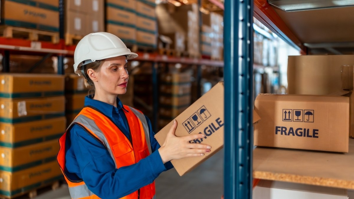 warehouse worker wearing a white hard hat